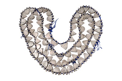 Lot 2 - AN ETHIOPIAN INDIGO BLUE STRING NECKLACE WITH SILVER GEOMETRIC AMULETS