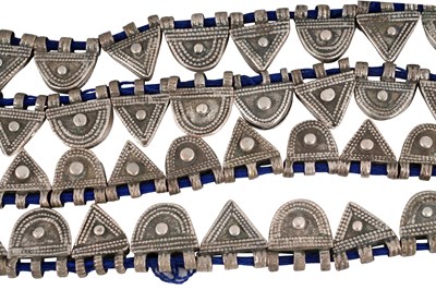 Lot 2 - AN ETHIOPIAN INDIGO BLUE STRING NECKLACE WITH SILVER GEOMETRIC AMULETS