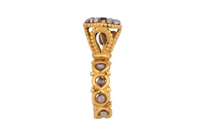 Lot 65 - A BYZANTINE-STYLE GARNET AND PEARL GOLD RING