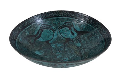 Lot 258 - A BLACK-PAINTED TURQUOISE-GLAZED SELJUK KASHAN-REVIVAL POTTERY DISH WITH COURTLY COUPLE