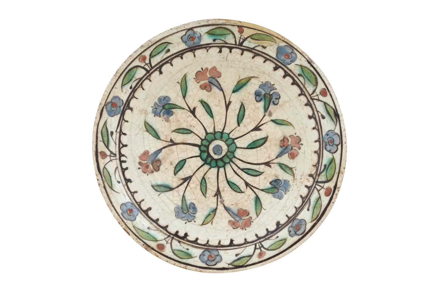 Lot 134 - AN IZNIK POTTERY DISH WITH RED AND BLUE HYACINTHS
