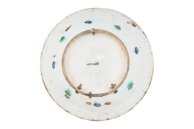Lot 135 - AN IZNIK POTTERY DISH WITH SAZ LEAF AND FLORAL TRIUMPH
