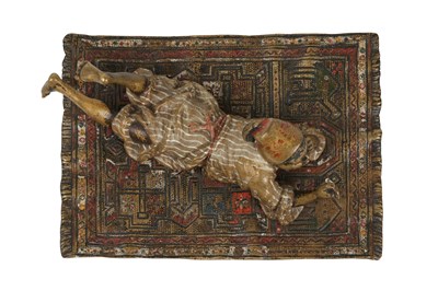 Lot 95 - A COLD-PAINTED BRONZE FIGURE OF A MOORISH BOY ON A CARPET
