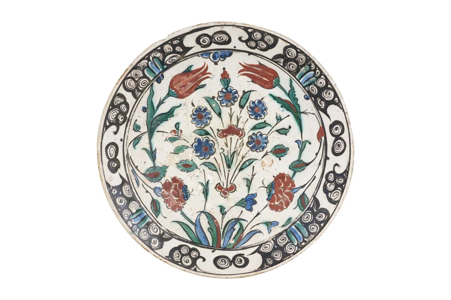 Lot 138 - AN IZNIK POTTERY DISH WITH TULIPS, ROSES AND PLUM BLOSSOMS
