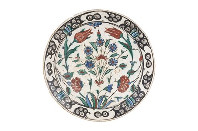 Lot 138 - AN IZNIK POTTERY DISH WITH TULIPS, ROSES AND PLUM BLOSSOMS