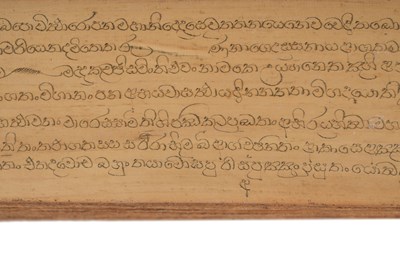 Lot 46 - A SINHALA PALM-LEAF BUDDHIST MANUSCRIPT WITH LACQUERED BOOK COVERS