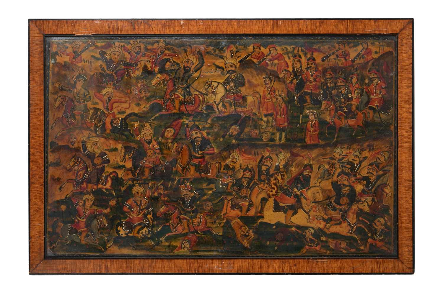 Lot 101 - A LARGE QAJAR LACQUERED PAPIER-MÂCHÉ PANEL WITH A BATTLE SCENE