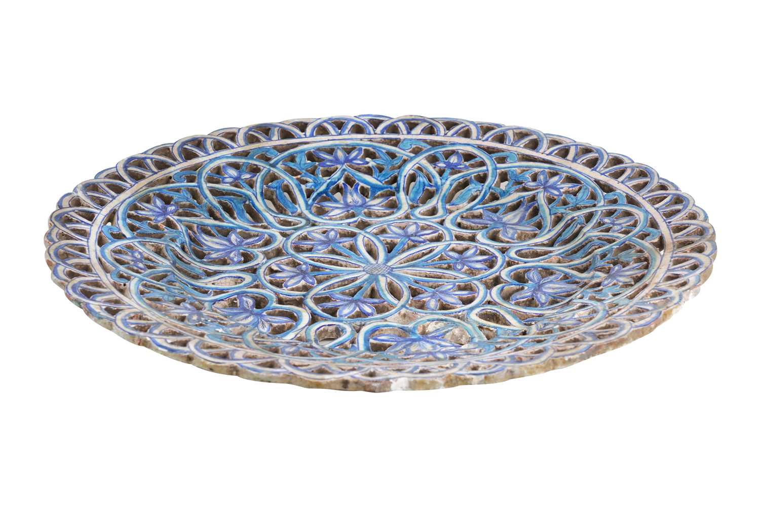Lot 132 - A LARGE COBALT BLUE AND TURQUOISE-PAINTED PIERCED POTTERY DISH WITH FLOWERS