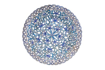 Lot 132 - A LARGE COBALT BLUE AND TURQUOISE-PAINTED PIERCED POTTERY DISH WITH FLOWERS