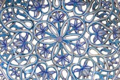 Lot 132 - A LARGE COBALT BLUE AND TURQUOISE-PAINTED PIERCED POTTERY DISH WITH FLOWERS