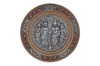 Lot 204 - A TANJORE SILVER AND COPPER-OVERLAID BRASS DISH WITH HINDU DEITIES