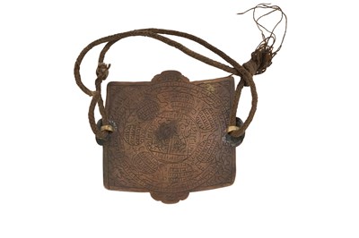 Lot 180 - AN ENGRAVED BRASS SHI’A TALISMANIC BAZUBAND (ARMBAND)