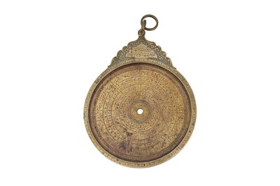 Lot 187 - A QAJAR BRASS ASTROLABE WITH FOUR PLATES