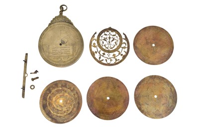 Lot 187 - A QAJAR BRASS ASTROLABE WITH FOUR PLATES