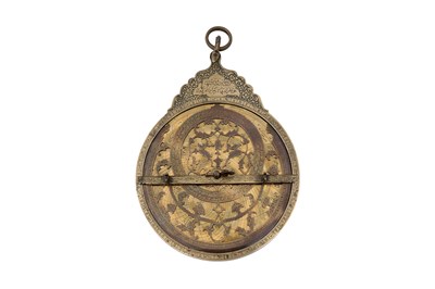 Lot 187 - A QAJAR BRASS ASTROLABE WITH FOUR PLATES