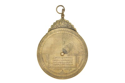 Lot 187 - A QAJAR BRASS ASTROLABE WITH FOUR PLATES