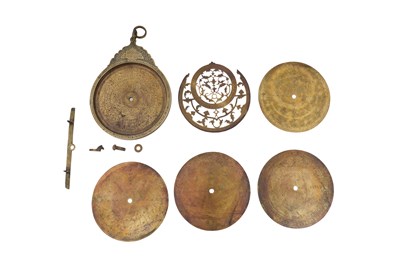 Lot 187 - A QAJAR BRASS ASTROLABE WITH FOUR PLATES