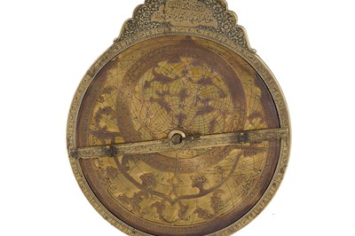 Lot 187 - A QAJAR BRASS ASTROLABE WITH FOUR PLATES