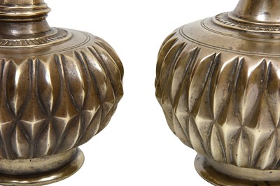 Lot 6 - A NEAR PAIR OF INDIAN HIGH-TIN GADROONED METAL BOTTLES WITH DIAMOND-SHAPED PATTERN