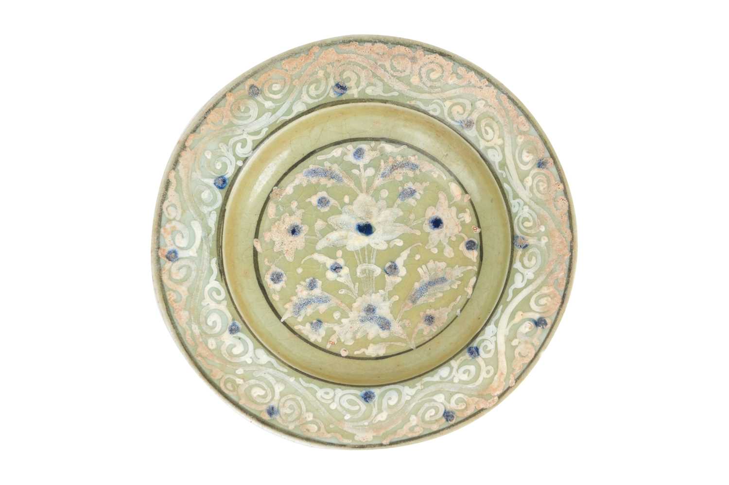 Lot 139 - A SAFAVID CELADON POTTERY DISH WITH LOTUS AND CLOUD MOTIFS