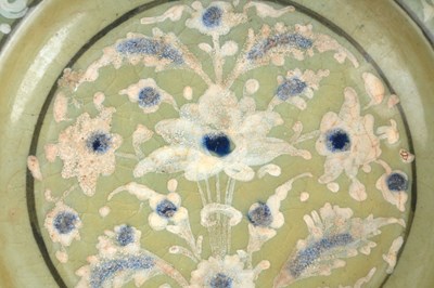 Lot 139 - A SAFAVID CELADON POTTERY DISH WITH LOTUS AND CLOUD MOTIFS