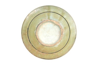 Lot 139 - A SAFAVID CELADON POTTERY DISH WITH LOTUS AND CLOUD MOTIFS