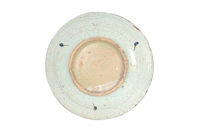 Lot 137 - AN IZNIK POTTERY DISH WITH RED-SPECKLED BLUE TULIPS