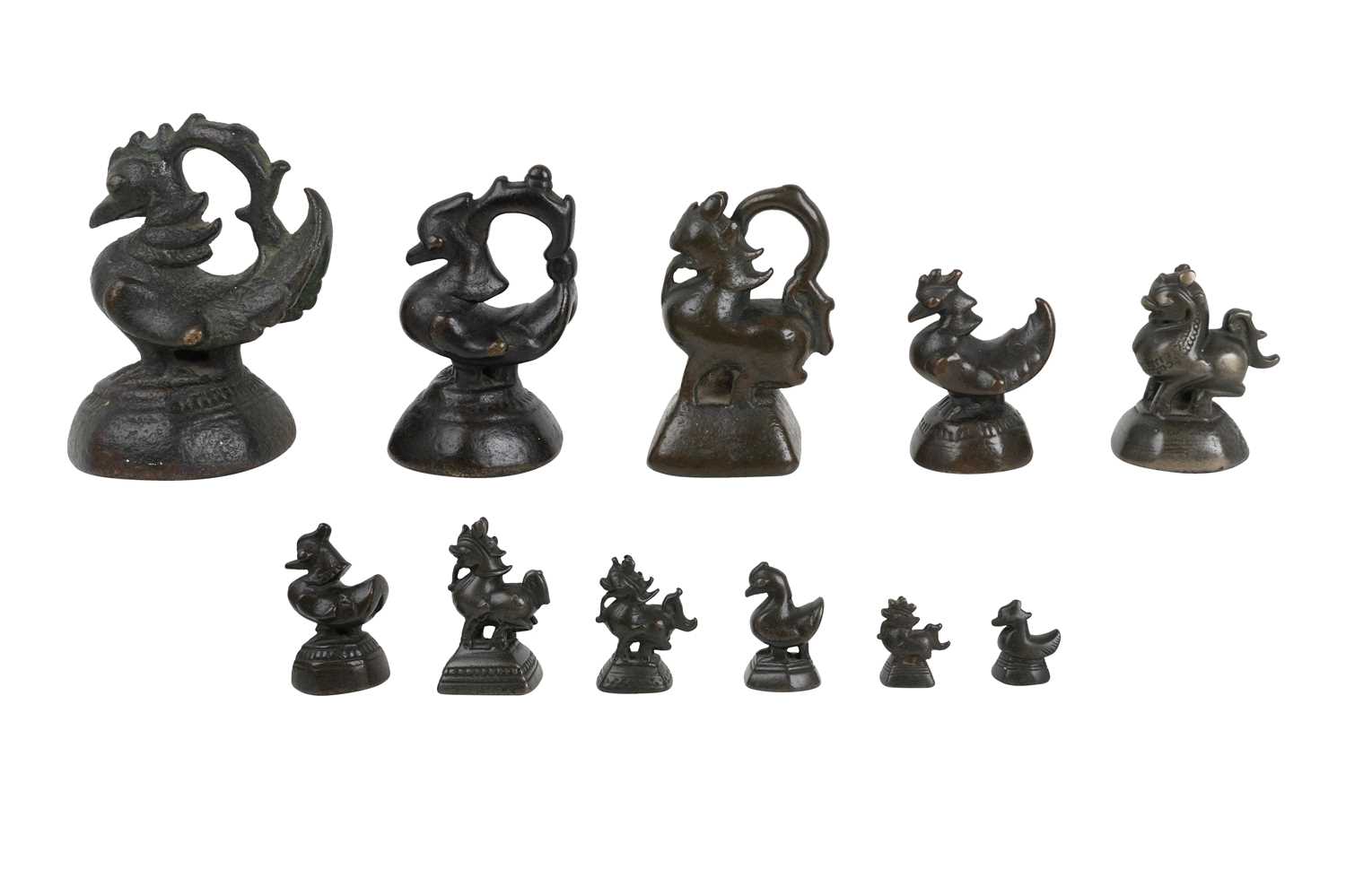 Lot 173 - ELEVEN BRONZE BURMESE OPIUM WEIGHTS WITH BRAHMI DUCKS AND QILINS