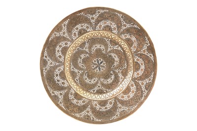 Lot 200 - A QAJAR OPENWORK SILVER-INLAID BRASS DISH
