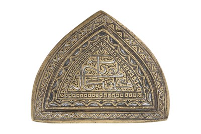 Lot 186 - AN ARCH-SHAPED BRASS MOULD OF SHI'A INTEREST