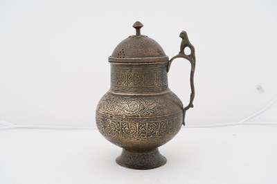 Lot 185 - A PERSIAN BRASS WINE JUG WITH LID