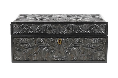 Lot 165 - λ A SINHALESE CARVED EBONY LIDDED BOX WITH IVORY-INLAID FLOWER VASE DECORATION