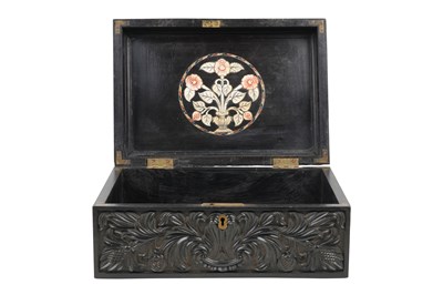 Lot 165 - λ A SINHALESE CARVED EBONY LIDDED BOX WITH IVORY-INLAID FLOWER VASE DECORATION