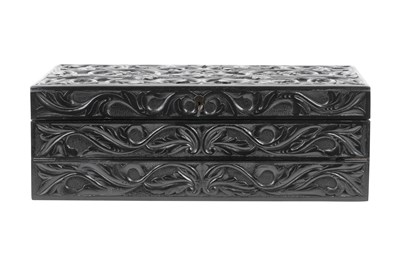 Lot 168 - λ A SINHALESE CARVED EBONY PORTABLE WRITING CABINET WITH IVORY-INLAID LIONS