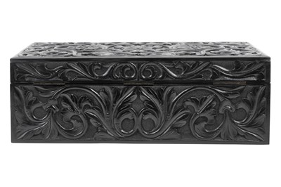 Lot 168 - λ A SINHALESE CARVED EBONY PORTABLE WRITING CABINET WITH IVORY-INLAID LIONS