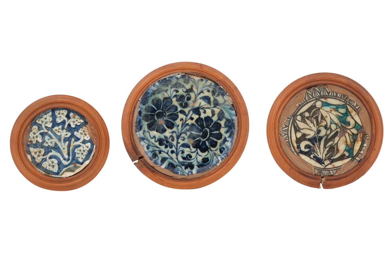 Lot 154 - THREE FRAGMENTS OF MAMLUK POTTERY DISHES WITH FLORAL DESIGNS