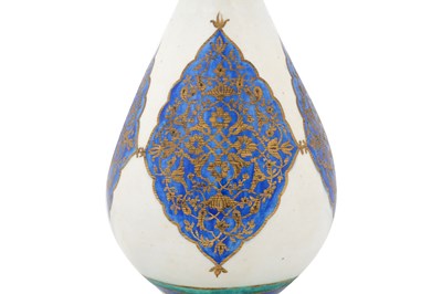 Lot 128 - AN ISLAMIC-REVIVAL KUTAHYA-STYLE GILT POTTERY VASE