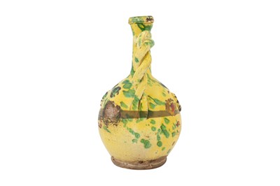 Lot 121 - A GOLD-ENAMELLED AND GREEN-SPLASHED YELLOW-GLAZED CANAKKALE POTTERY EWER