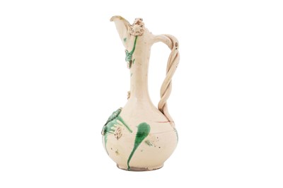 Lot 118 - A GREEN-SPLASHED WHITE-GLAZED CANAKKALE POTTERY EWER