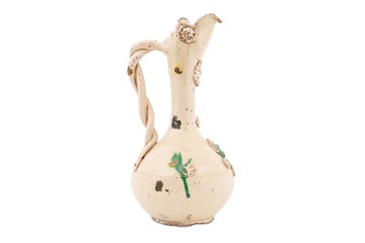Lot 118 - A GREEN-SPLASHED WHITE-GLAZED CANAKKALE POTTERY EWER