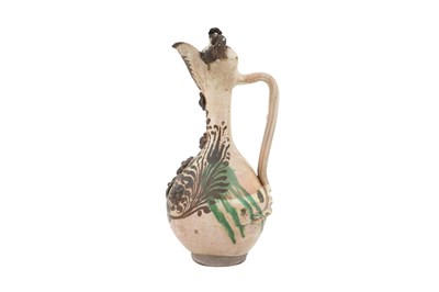 Lot 119 - A LARGE GOLD-ENAMELLED AND GREEN-SPLASHED WHITE-GLAZED CANAKKALE POTTERY EWER