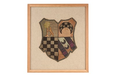 Lot 107 - AN EMBROIDERED HERALDIC TEXTILE PANEL WITH A BEAR, TREE, CRESCENTS AND CHECKERS