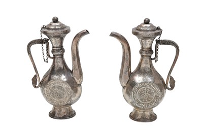 Lot 129 - A PAIR OF SILVER EWERS WITH NASTA'LIQ CALLIGRAPHY AND DRAGON HANDLES