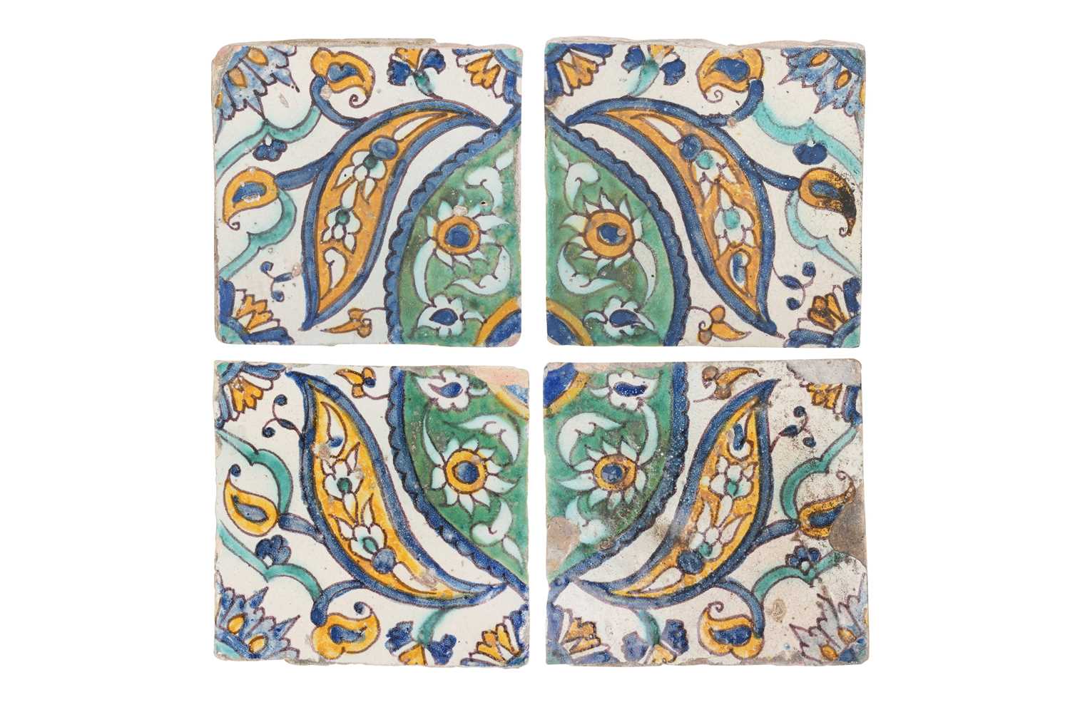 Lot 146 - FOUR TUNISIAN POLYCHROME-PAINTED CUERDA SECA POTTERY TILES
