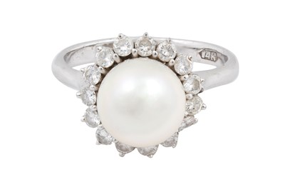 Lot 18 - A 14K WHITE GOLD CULTURED PEARL AND DIAMOND CLUSTER RING.