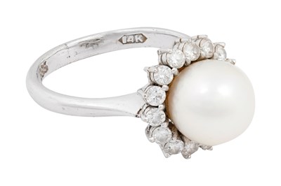 Lot 18 - A 14K WHITE GOLD CULTURED PEARL AND DIAMOND CLUSTER RING.