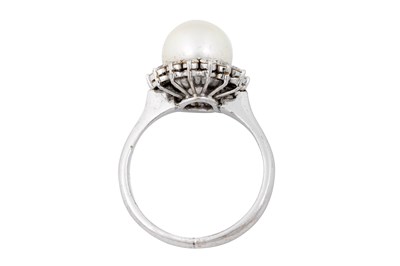 Lot 18 - A 14K WHITE GOLD CULTURED PEARL AND DIAMOND CLUSTER RING.