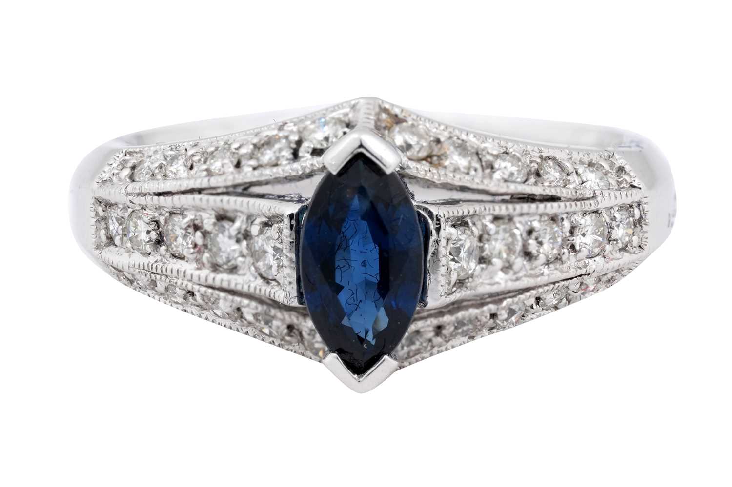Lot 20 - A 18K WHITE GOLD MARQUISE-CUT SAPPHIRE AND DIAMOND COCKTAIL RING.