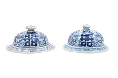Lot 61 - A NEAR-PAIR OF CHINESE BLUE AND WHITE 'SHUANGXI' JAR COVERS