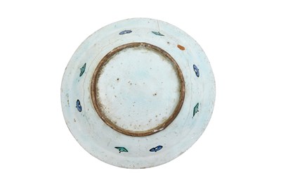 Lot 133 - AN IZNIK POTTERY DISH WITH ARABESQUE, SAZ LEAVES, AND FLORAL DECORATION